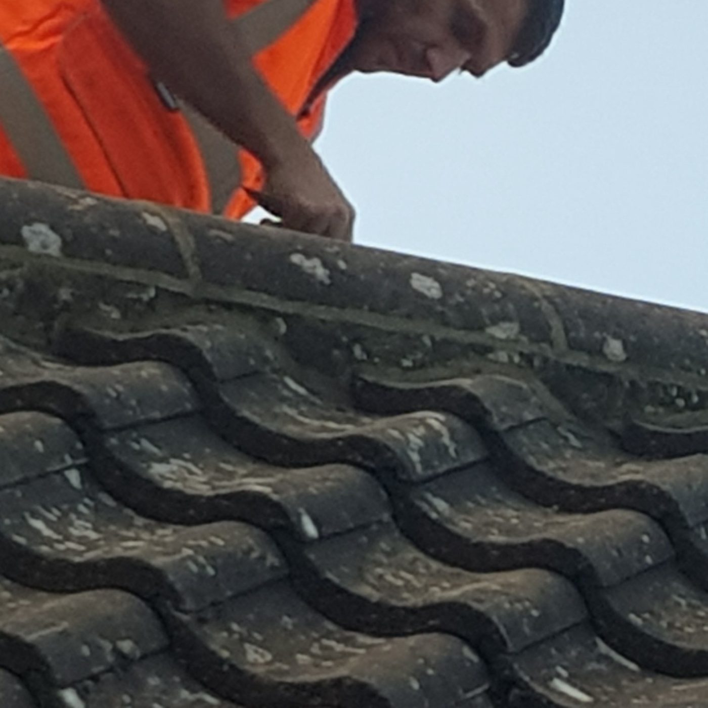 Roof tile repair close-up